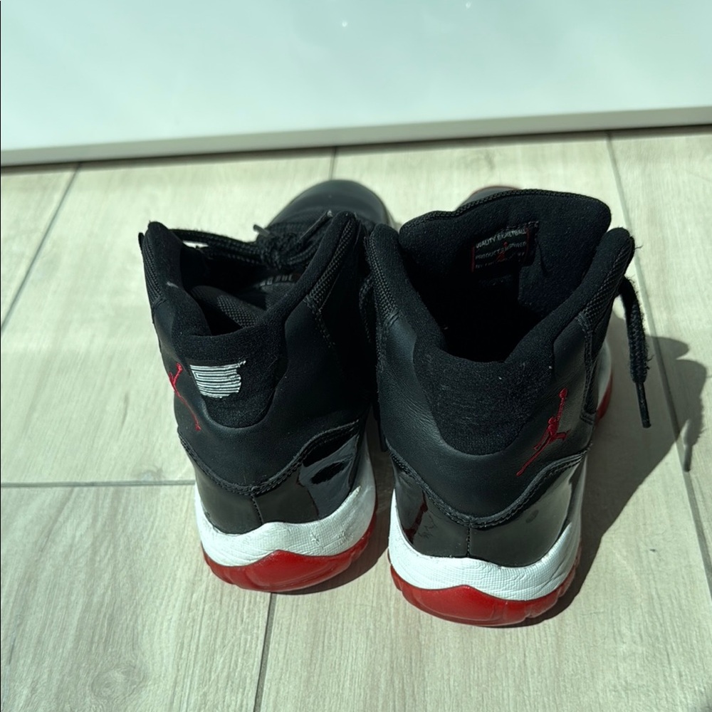 Nike Black and Red High-Top Sneakers Air Jordans Breed 11’s